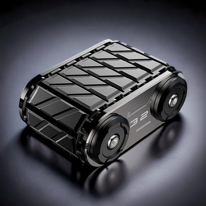 The Curious Mind Metal Tank Spinner, a tactical fidget toy with a metallic grey and black finish, featuring a textured top and wheel-like ends.