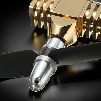 The Curious Mind Mini Aircraft Stirling Engine Display Model, gold metal engine with black propeller, desktop mechanical model.