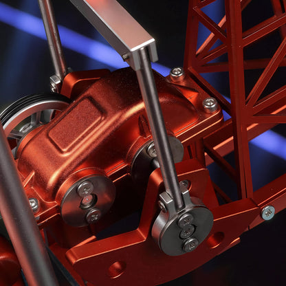 The Curious Mind Oil Derrick Pumping Unit DIY Kit is a detailed metal model with a red metallic finish, featuring intricate mechanical components and a lattice tower structure.