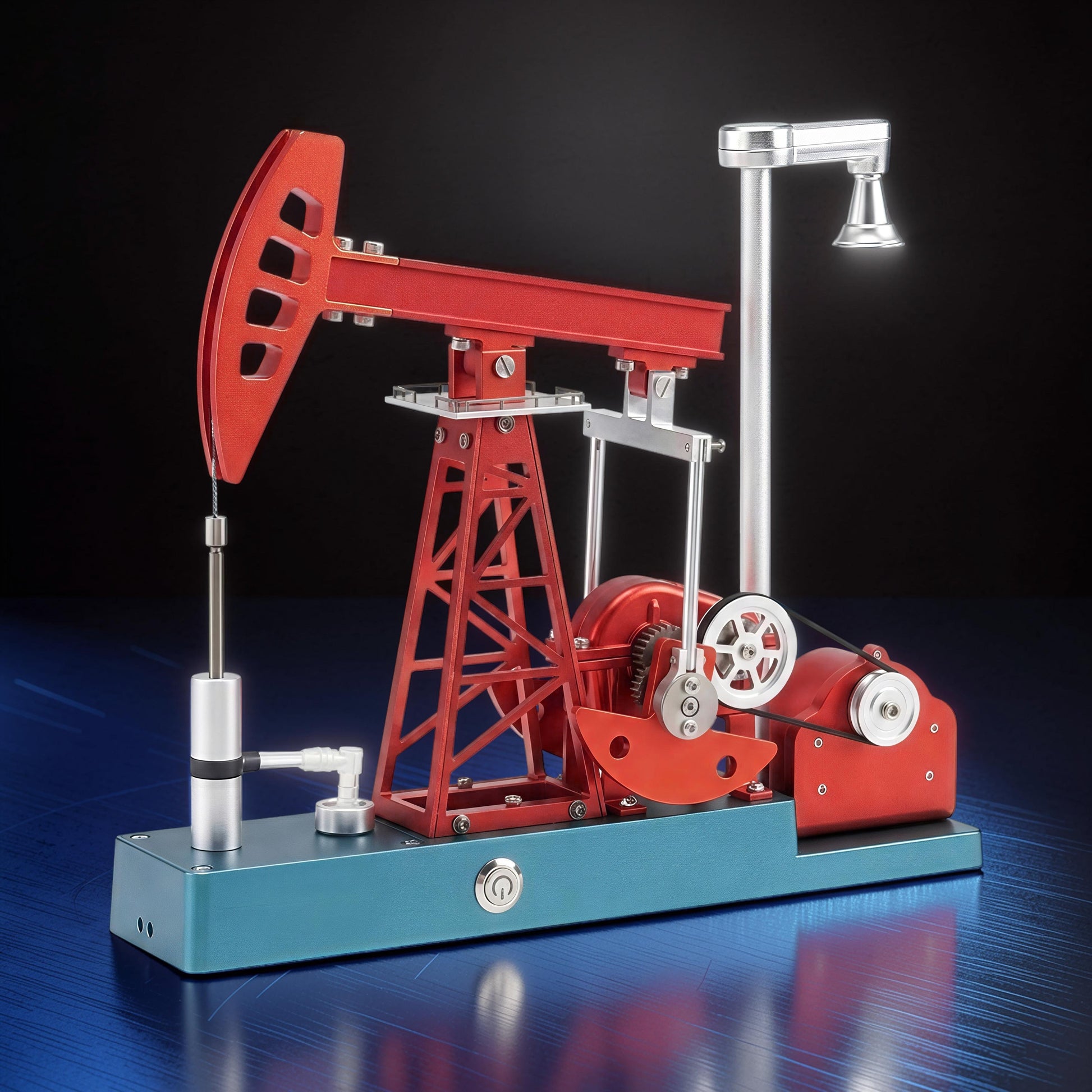 The Curious Mind Oil Derrick Pumping Unit DIY Kit, a detailed metal model with red and blue components, featuring a functioning arm and light.