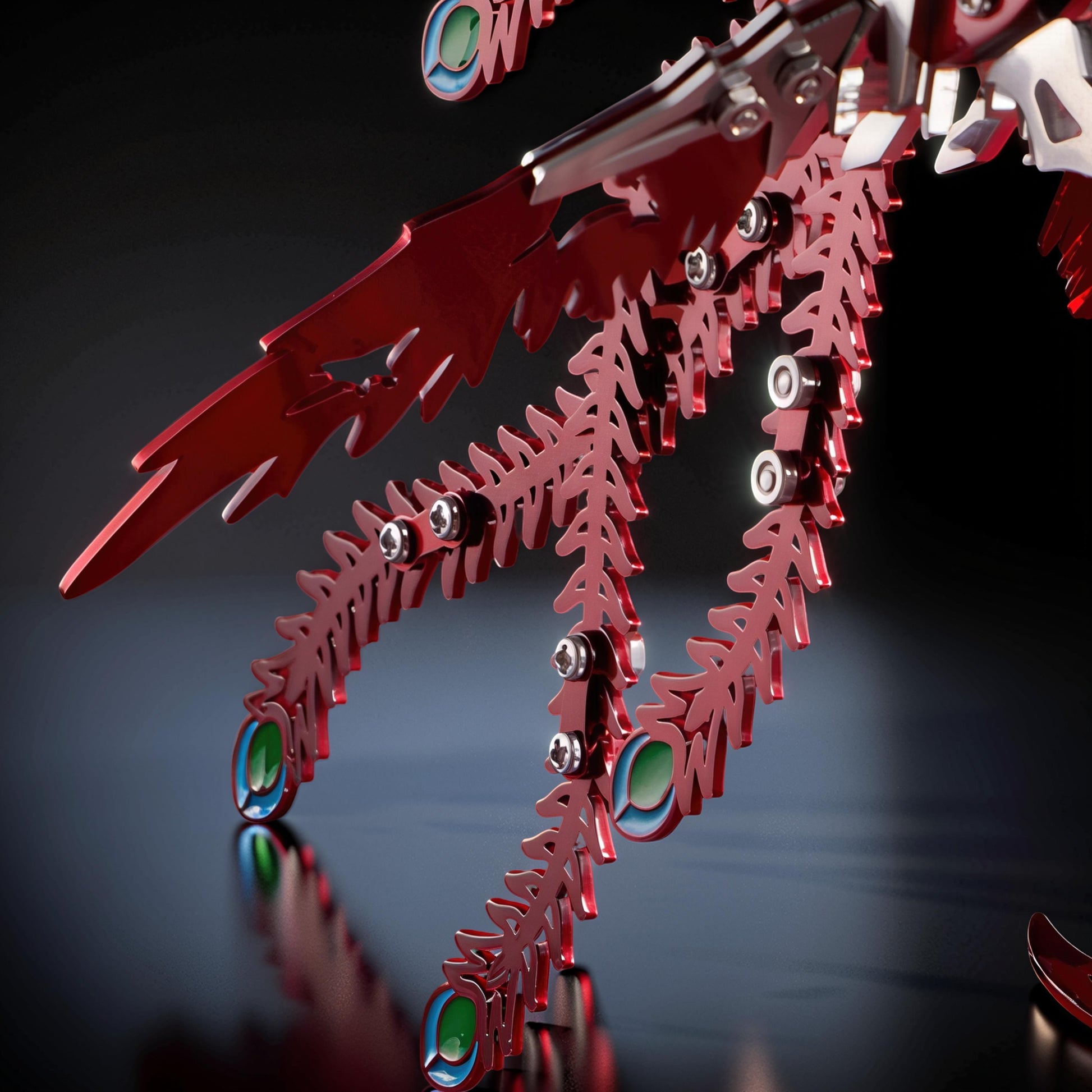 The Curious Mind Phoenix DIY Kit, a red metal mechanical creature model with silver accents and blue-green eye details.