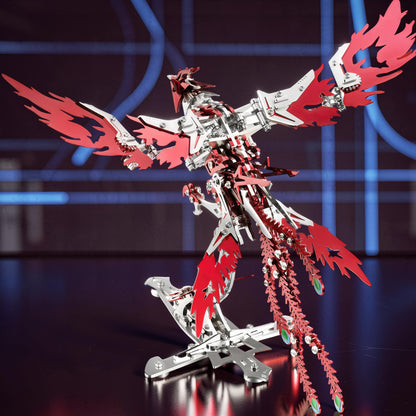 The Curious Mind Phoenix DIY Kit, a metallic mechanical bird model with silver and red parts, featuring intricate wing and tail details.