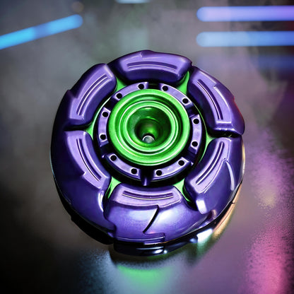 The Curious Mind Open Armour Hand Spinner is a metal fidget toy in purple and green with a balanced profile for smooth rotation.