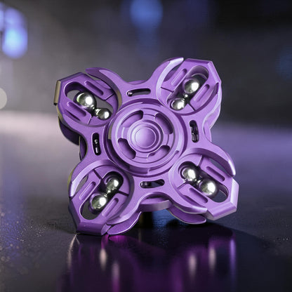 The Curious Mind Oracle Metal EDC Fidget Spinner in purple, featuring a precision metal design with four arms and silver bearings for smooth tactile focus.