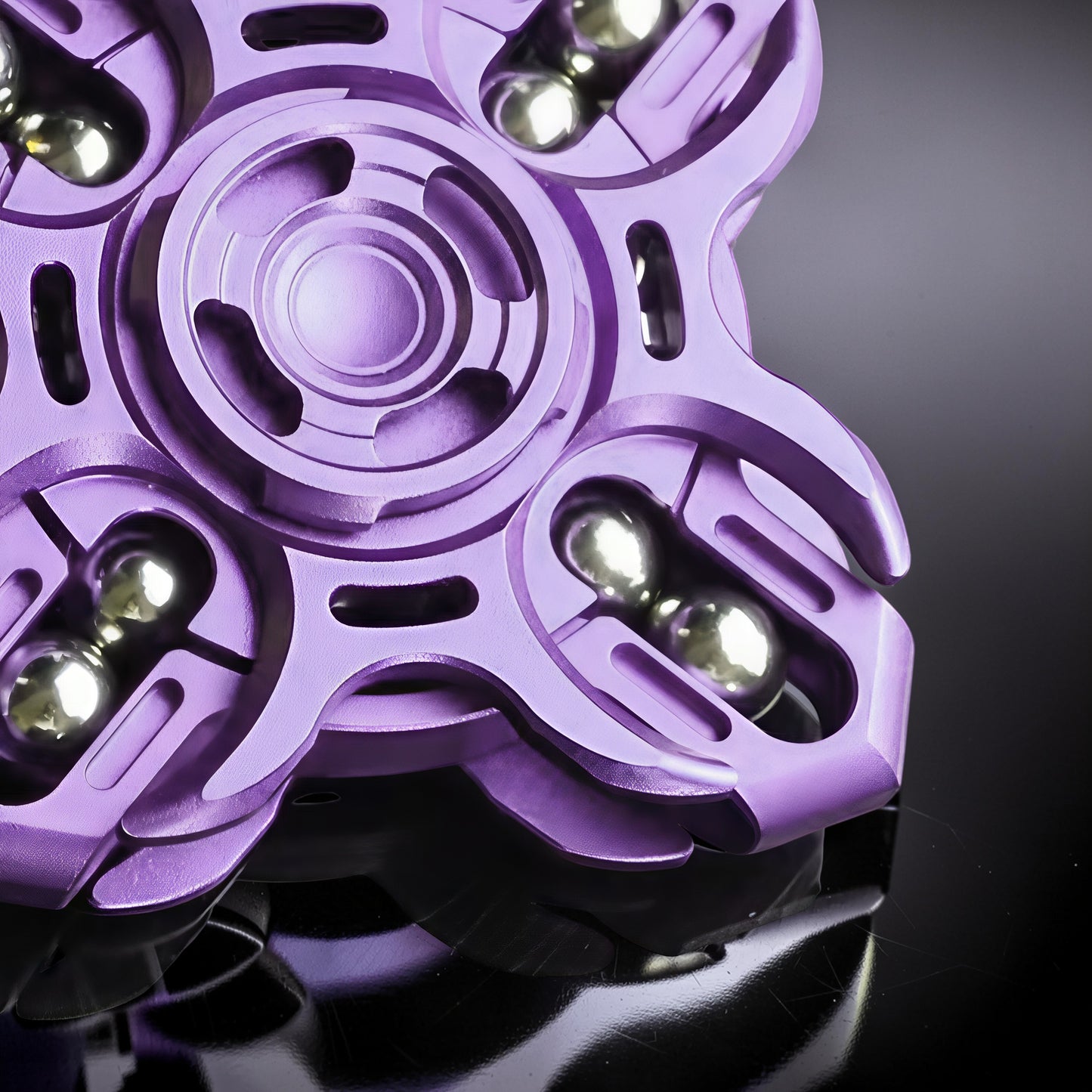 The Curious Mind Oracle Metal EDC Fidget Spinner in purple, featuring a precision metal build with smooth tactile action and silver bearings.
