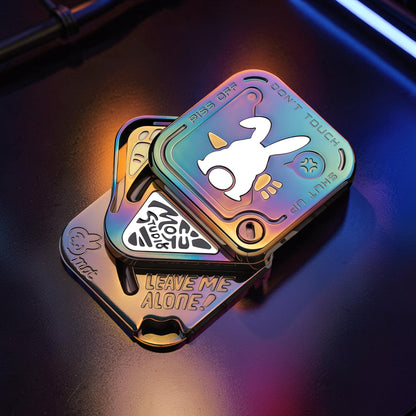 The Curious Mind Rabbit Tuning Fork Clicker fidget toy with iridescent metal finish and rabbit graphic.
