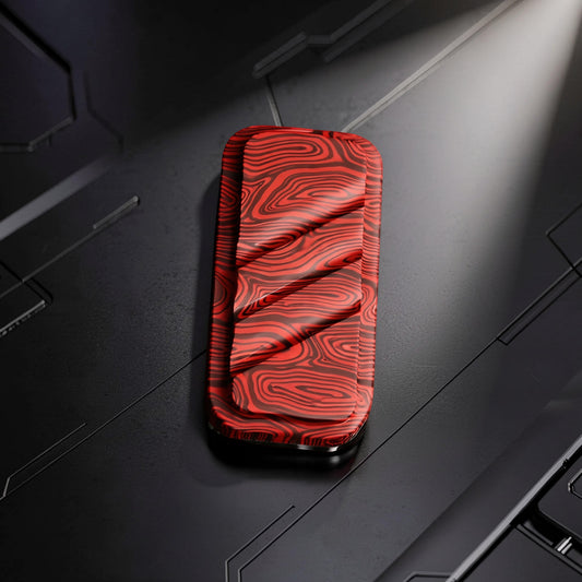 The Curious Mind Three-Layer Push Card Slider with red and black wood grain pattern. Compact metal fidget toy.