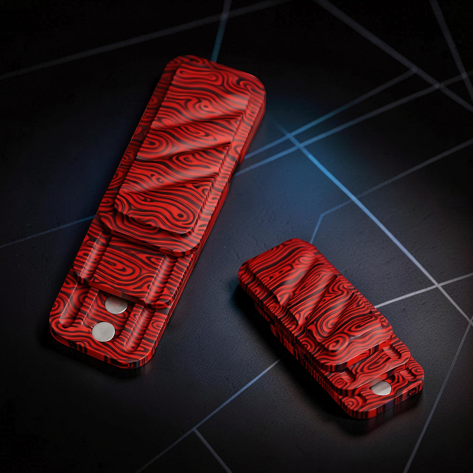 The Curious Mind Three-Layer Push Card Slider fidget toy in red and black Damascus pattern metal.