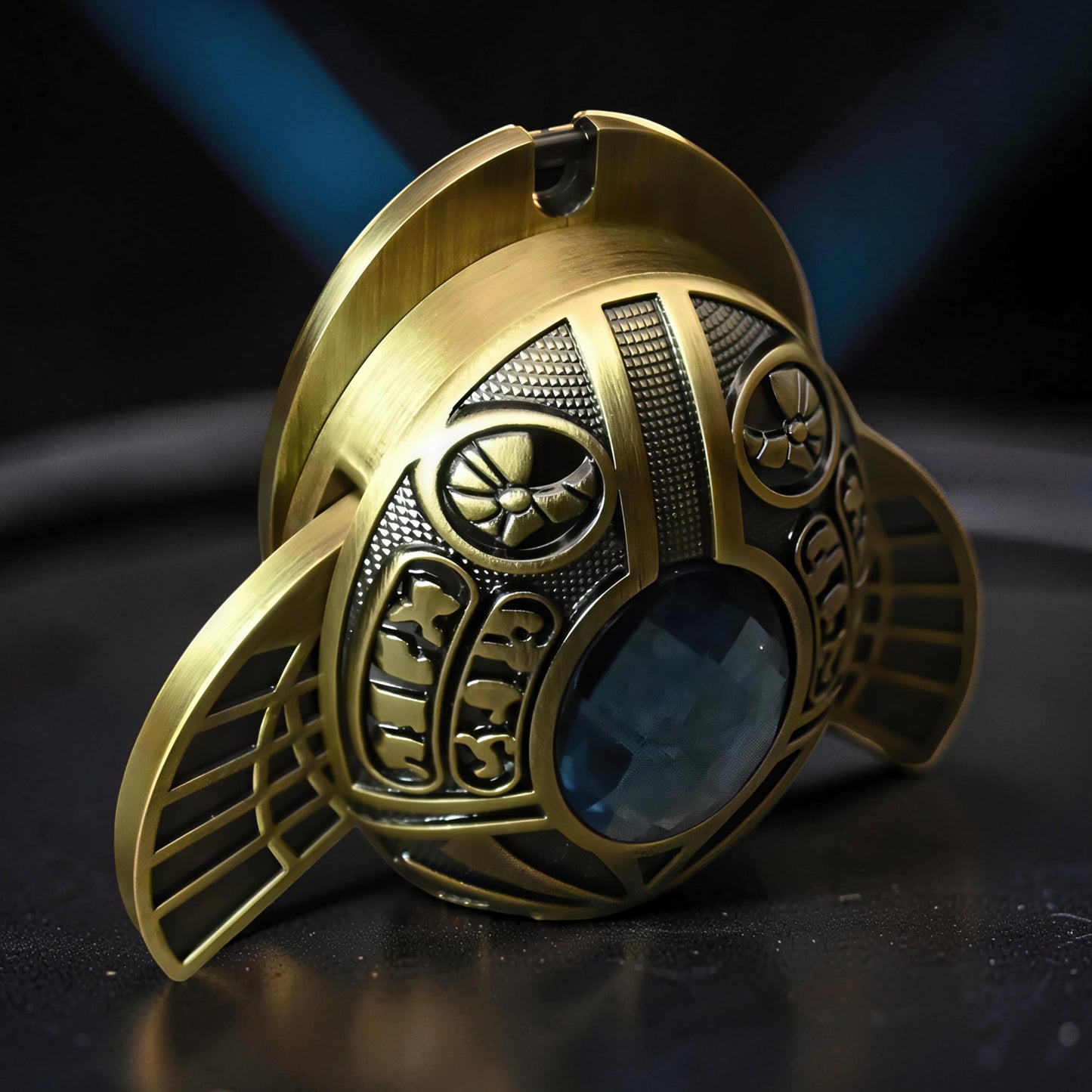 The Curious Mind Scarab Metal EDC Fidget Spinner with blue gem and intricate Egyptian-inspired detailing.