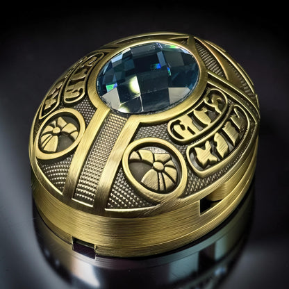 The Curious Mind Scarab Metal EDC Fidget Spinner with blue gem and intricate gold-tone detailing.