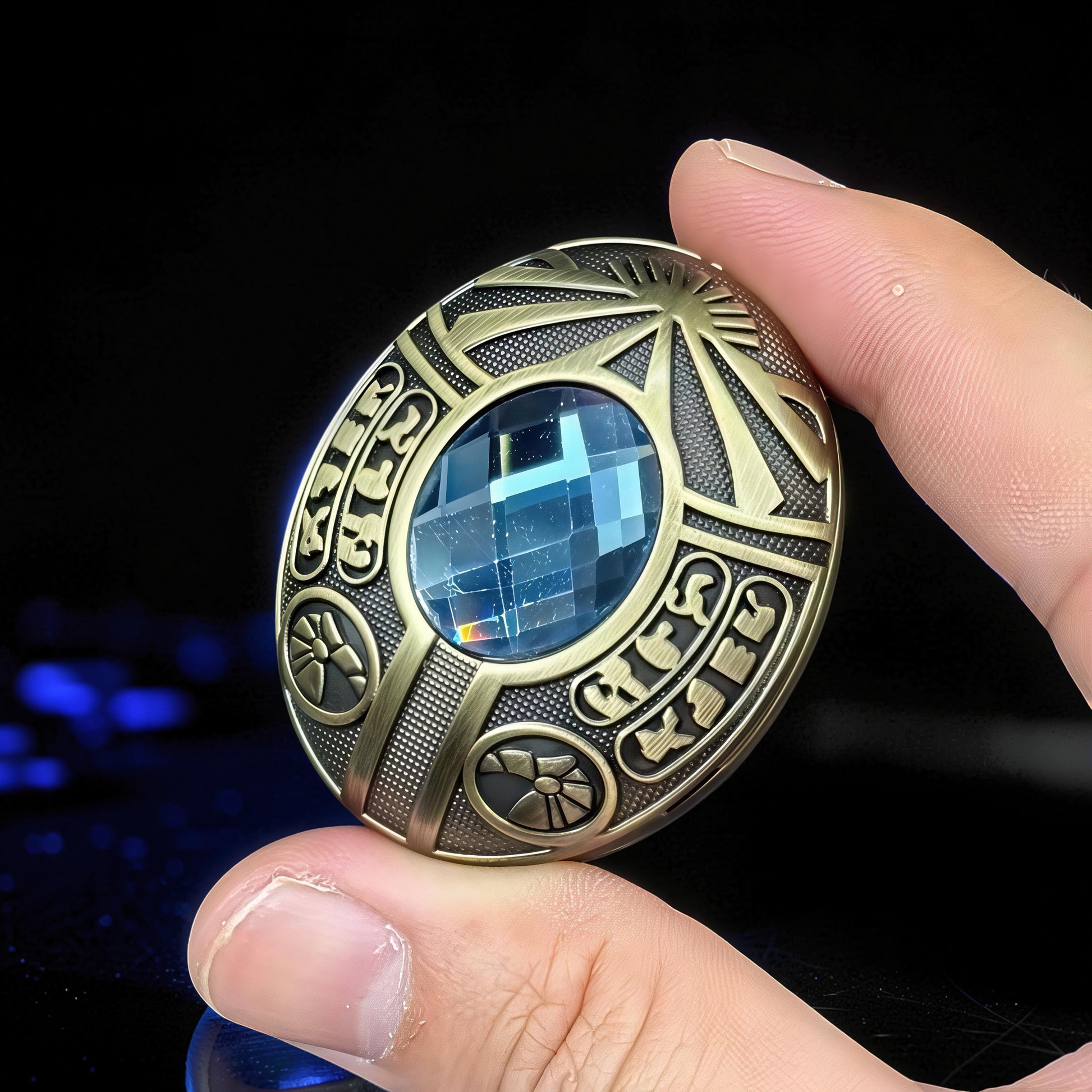 The Curious Mind Scarab Metal EDC Fidget Spinner with blue gem and intricate bronze-tone detailing.