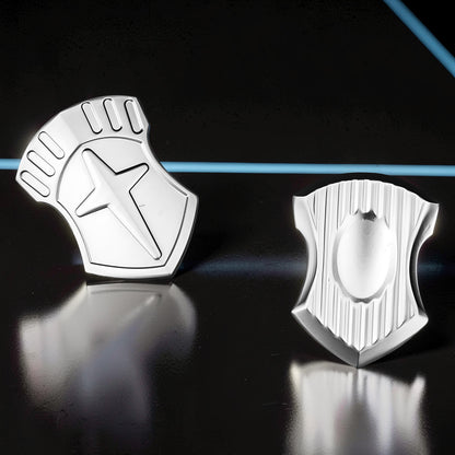 The Curious Mind Shield Fingertip Spinner, a compact EDC metal spinner with a star design and ribbed detailing.