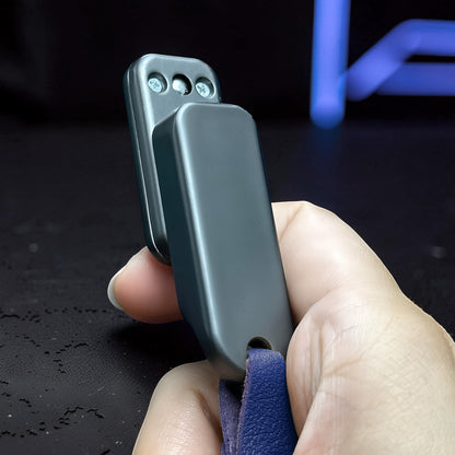 The Curious Mind Silver Buckle Card Slider fidget toy made of zinc alloy with a push-and-return motion.