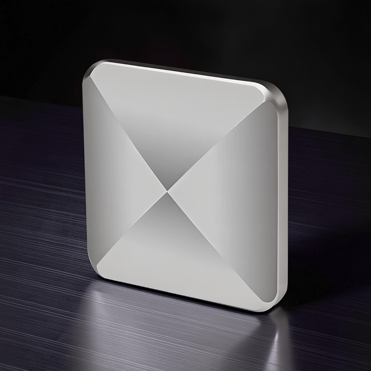 The Curious Mind Flipo Flip Square kinetic desk spinner, silver metal, geometric design, for focus and stress relief.