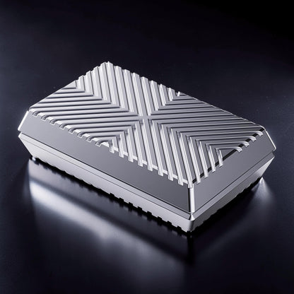 The Curious Mind Cube Push Slider fidget toy, a compact silver metal cube with a geometric grooved top for tactile stimulation.