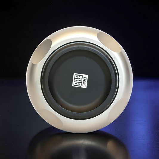 The Curious Mind Magnetic Master 2.0 Spinner is a premium silver metal fidget toy with a black center and magnetic accents for tactile play.
