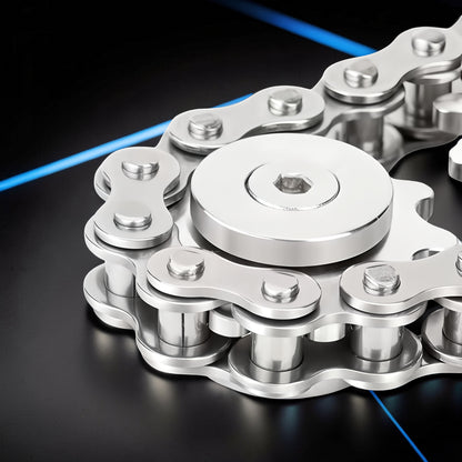 The Curious Mind Gear Chain Sprocket Spinner, a silver metal fidget toy with a gear and chain design.
