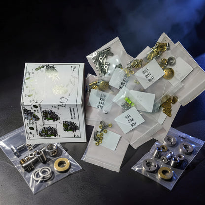 The Curious Mind Spider DIY Kit - Style F metal mechanical creature model kit with instruction manual and parts sorted in bags.