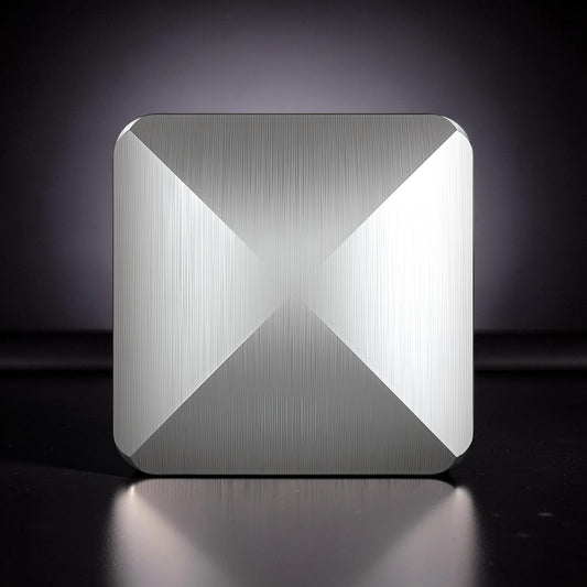The Curious Mind Flipo Flip Square Desk Spinner, brushed aluminum kinetic sculpture with faceted design for focus and stress relief.