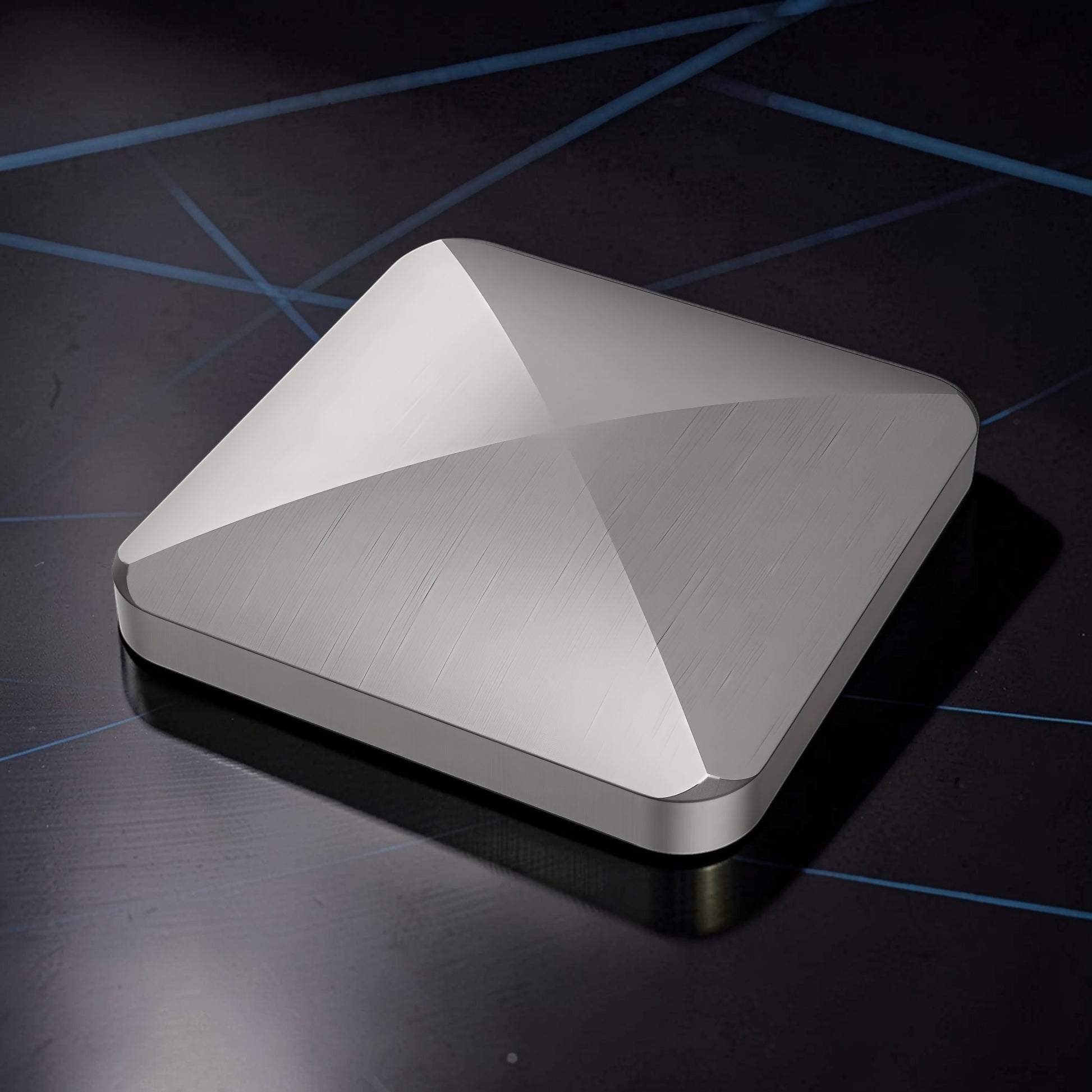 The Curious Mind Flipo Flip Square Desk Spinner, brushed aluminum kinetic sculpture with faceted design for focus and stress relief.