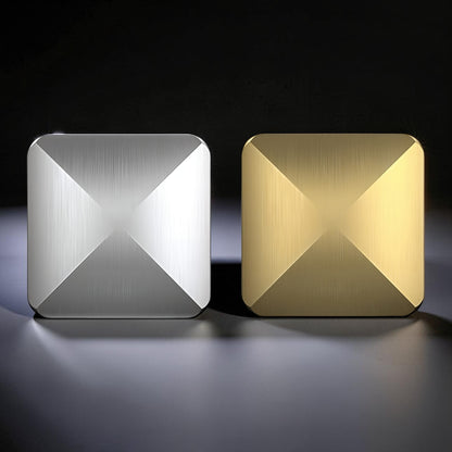 The Curious Mind Flipo Flip Square Desk Spinner in brushed aluminum, silver and gold finishes. Kinetic sculpture with faceted design.
