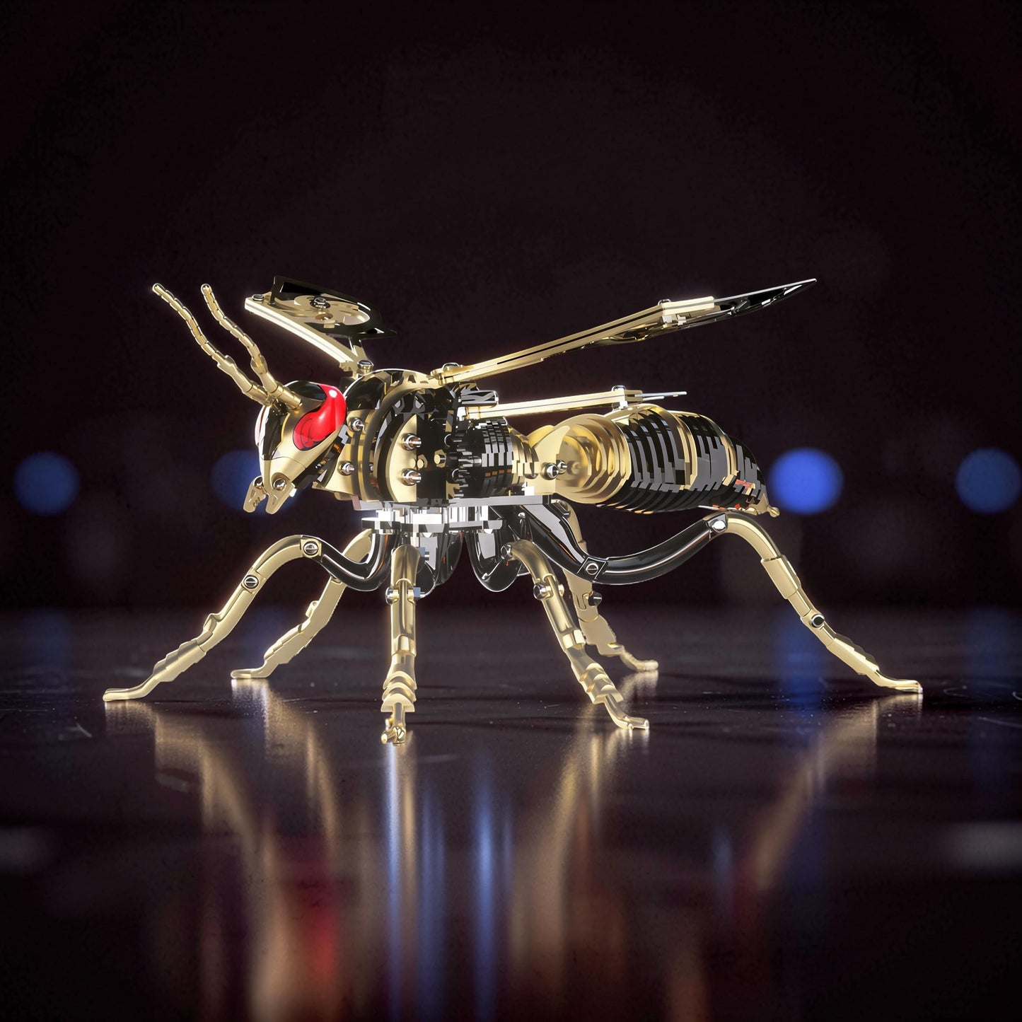 The Curious Mind Stainless Wasp 3D metal model kit, gold and silver finish, intricate mechanical design with red eyes.