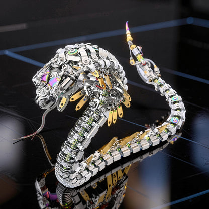 The Curious Mind Steampunk Cobra 3D metal model kit, intricate mechanical snake with metallic silver and gold accents, detailed gears and joints.