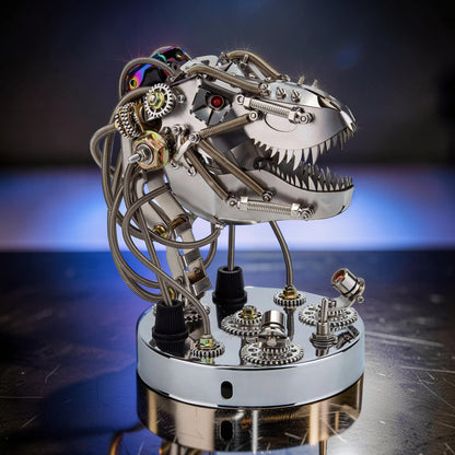 The Curious Mind Steampunk dinosaur head model kit made of polished metal with intricate gears, springs, and wires. Features sharp teeth and red eyes.