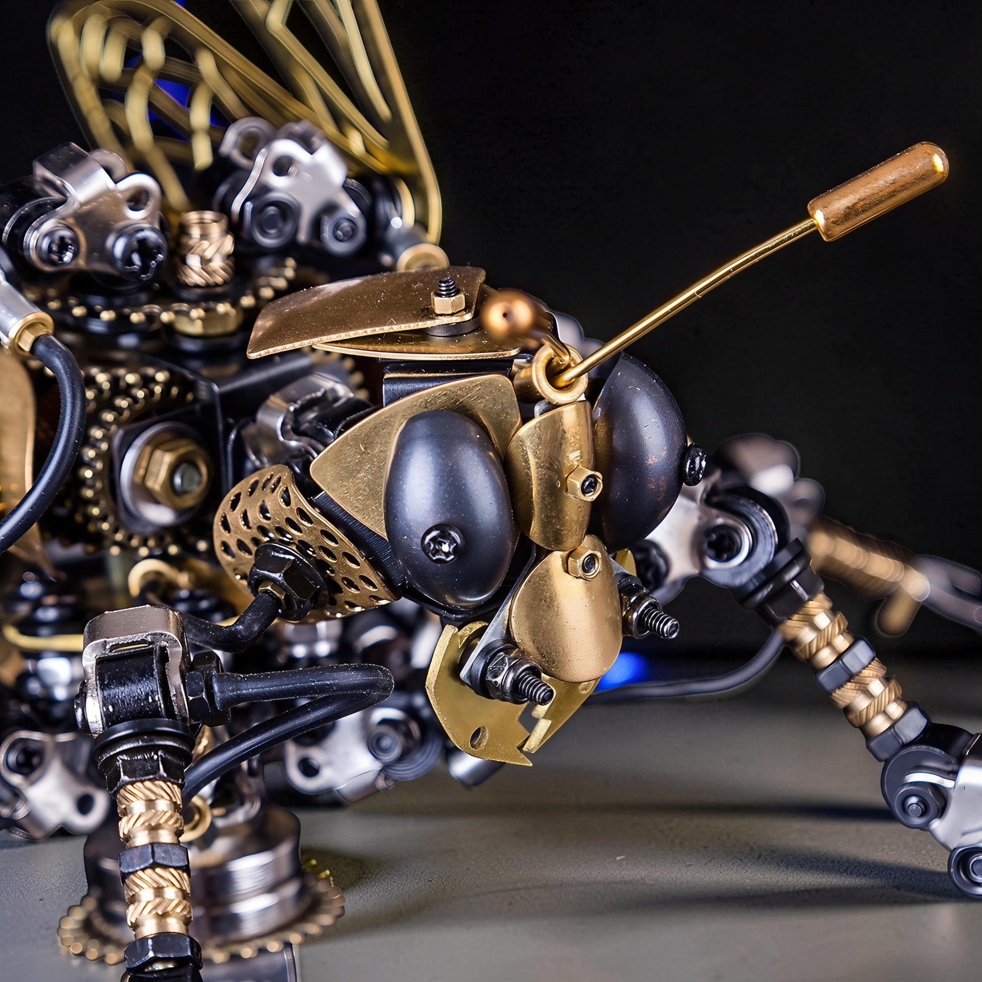 The Curious Mind Wasp with Voice-Activated Light, a steampunk metal model kit with intricate gears, black and gold accents, and detailed mechanical wings.