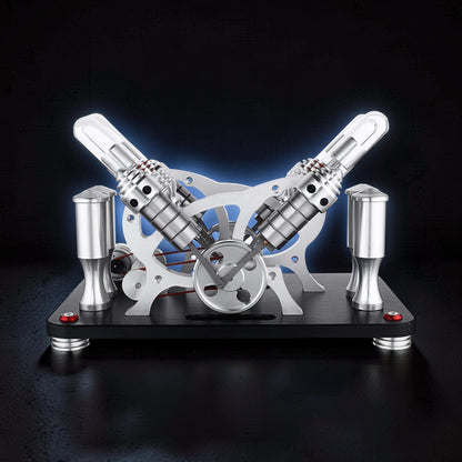 The Curious Mind Stirling Engine V4 Display Model, a metal mechanical model with dual cylinders and a flywheel, ideal for desks and gifts.