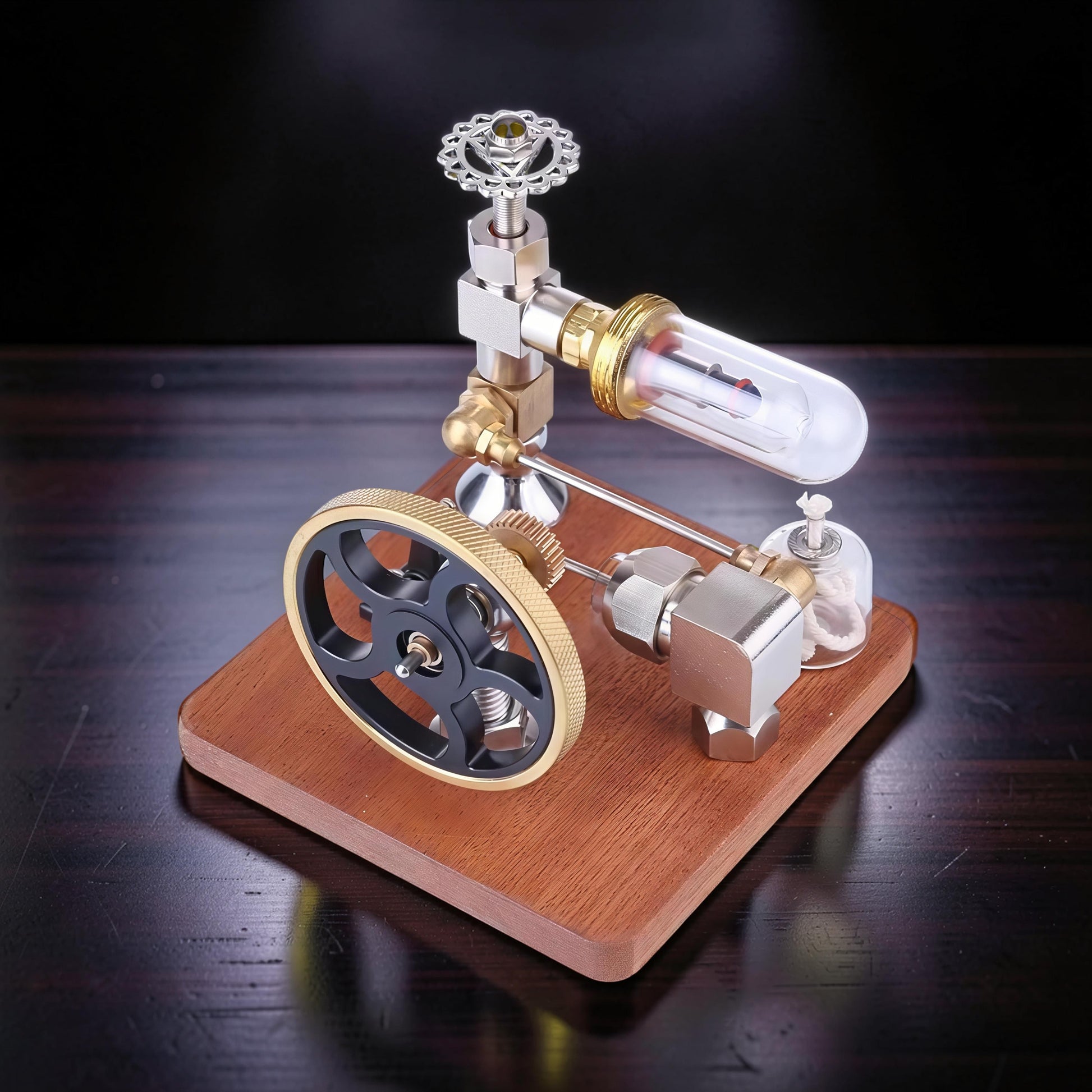 The Curious Mind Stirling Engine with adjustable speed controller, made from metal, wood, and quartz glass. Features a flywheel, cylinder, and decorative top.