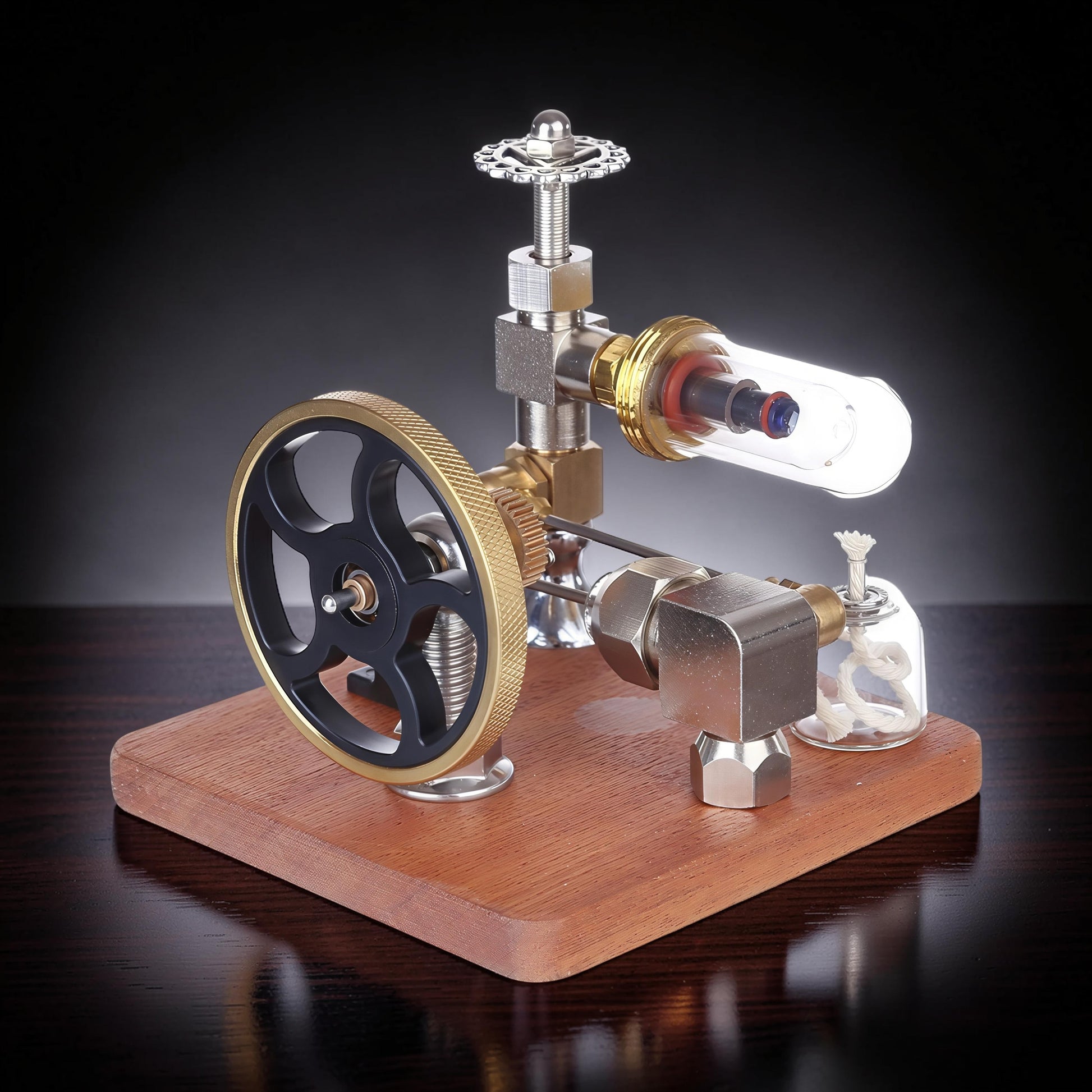 The Curious Mind Stirling Engine with adjustable speed controller, made from metal, wood, and glass. Features a flywheel, cylinder, and burner.