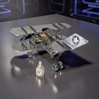The Curious Mind Stirling Engine Model Aircraft, a metal biplane with visible engine components and a star emblem on the tail.