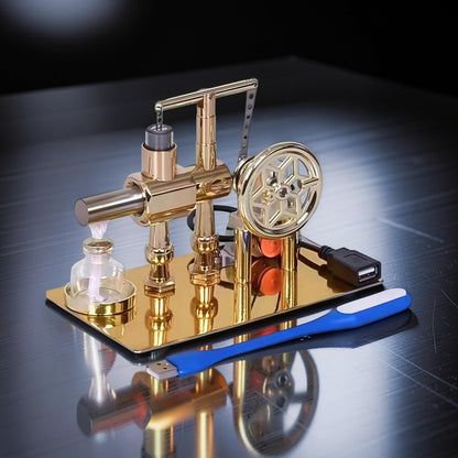 The Curious Mind Stirling Engine Model, a polished gold metal mechanical model with a USB-powered LED light and power generation capabilities.
