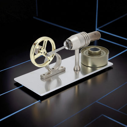 The Curious Mind Classic Stirling Engine Display mechanical model, made of metal with a gold flywheel and silver base. Ideal for desktop display.