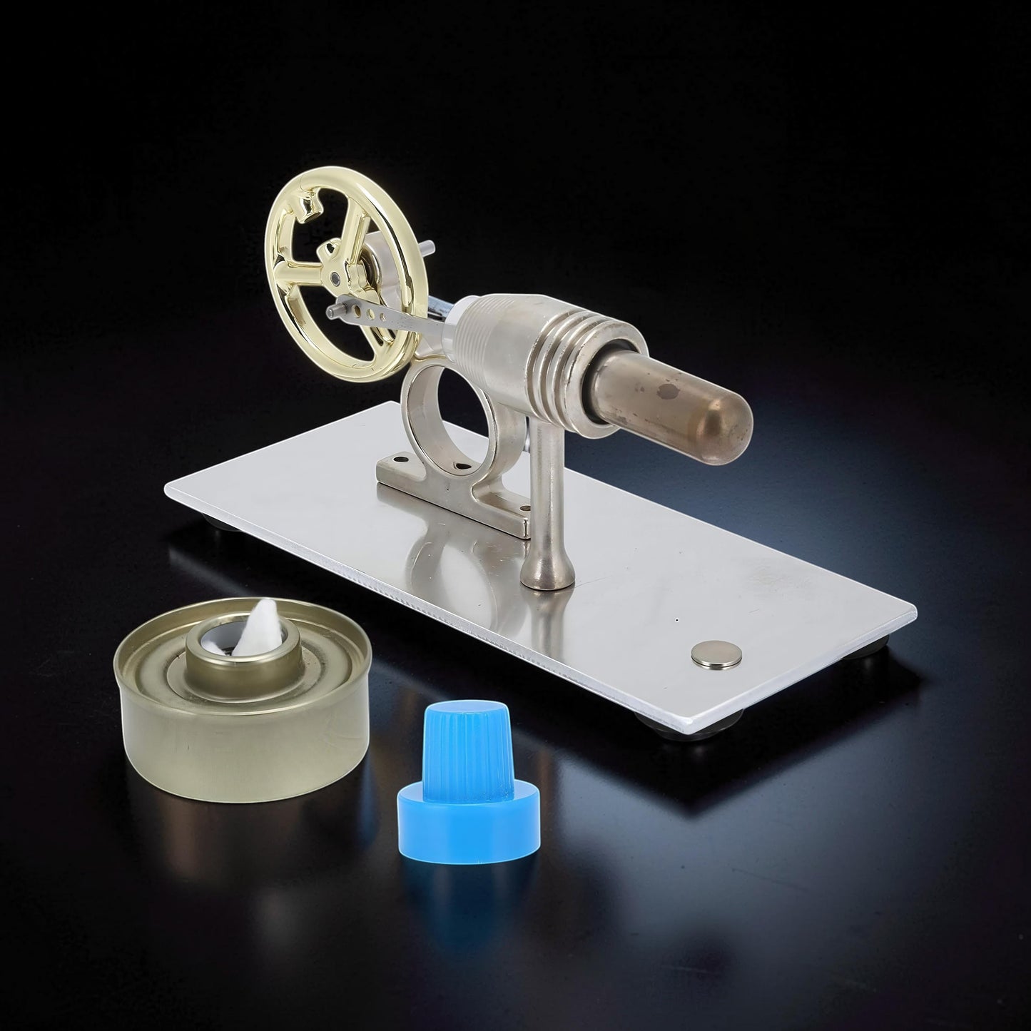 The Curious Mind Classic Stirling Engine Display, a metal mechanical model with a gold flywheel and a fuel wick.