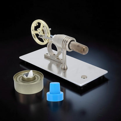 The Curious Mind Classic Stirling Engine Display, a metal mechanical model with a gold flywheel and a fuel wick.