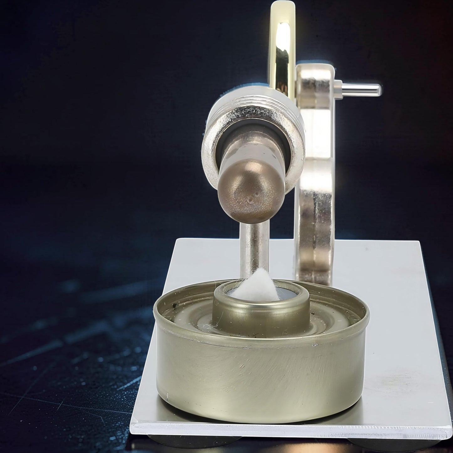 The Curious Mind Classic Stirling Engine Display mechanical model with metal construction and a cotton wick in a fuel cup.