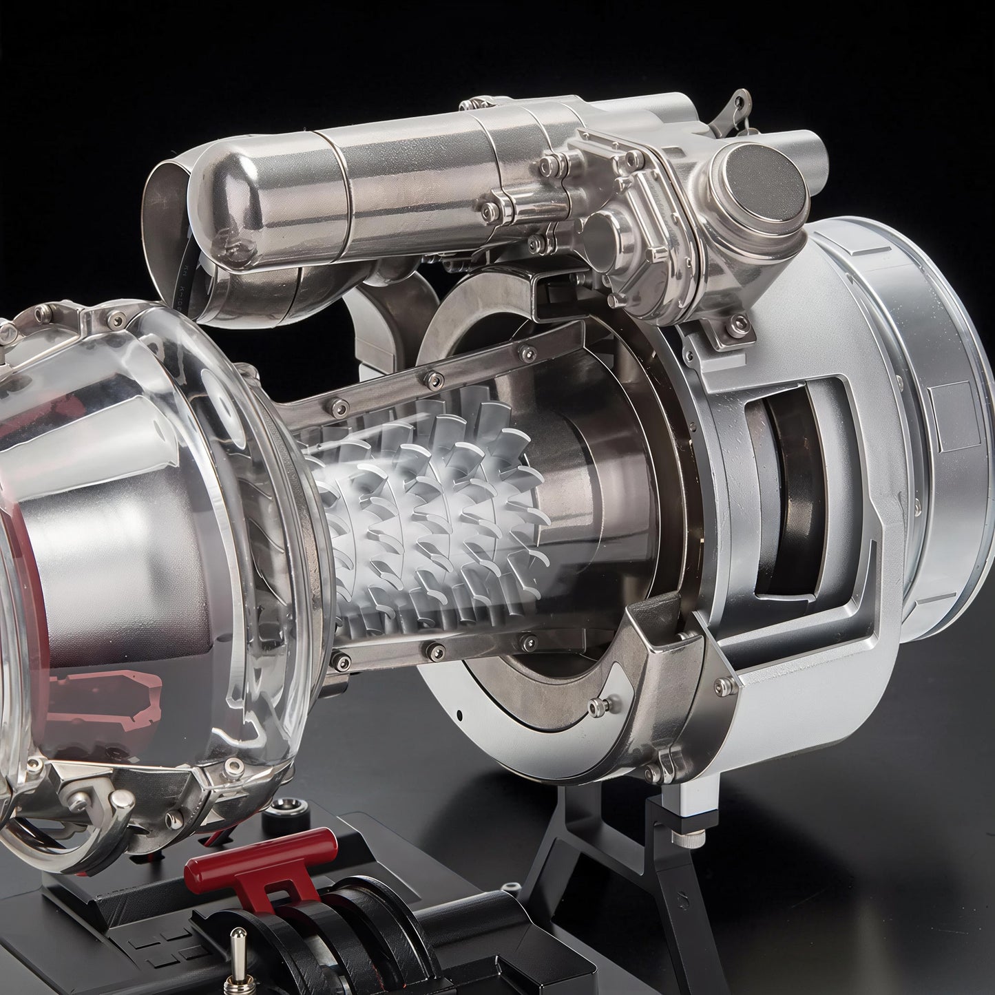 The Curious Mind T700 turboshaft engine model kit, a detailed metal and clear plastic replica with visible turbine blades and control panel.