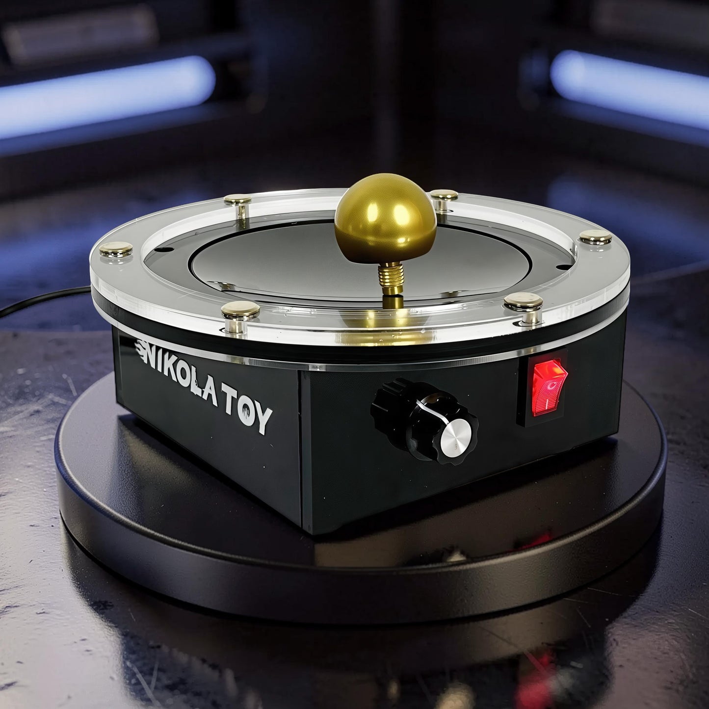 The Curious Mind Tesla Columbus Eggs Experiment Set, a black metal and plastic interactive physics display with a gold sphere on top, a red switch, and a black dial.