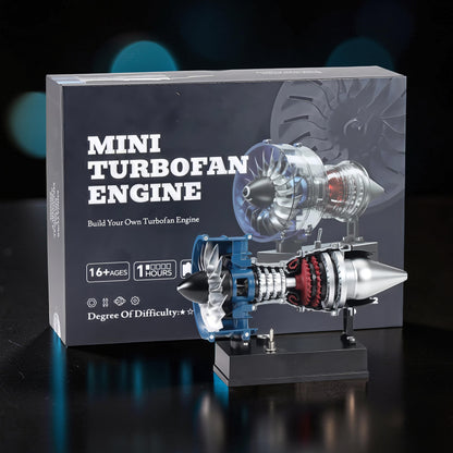 The Curious Mind Mini Turbofan Engine DIY Kit, a detailed PLA model with clear blue and silver components, displayed on a black stand.