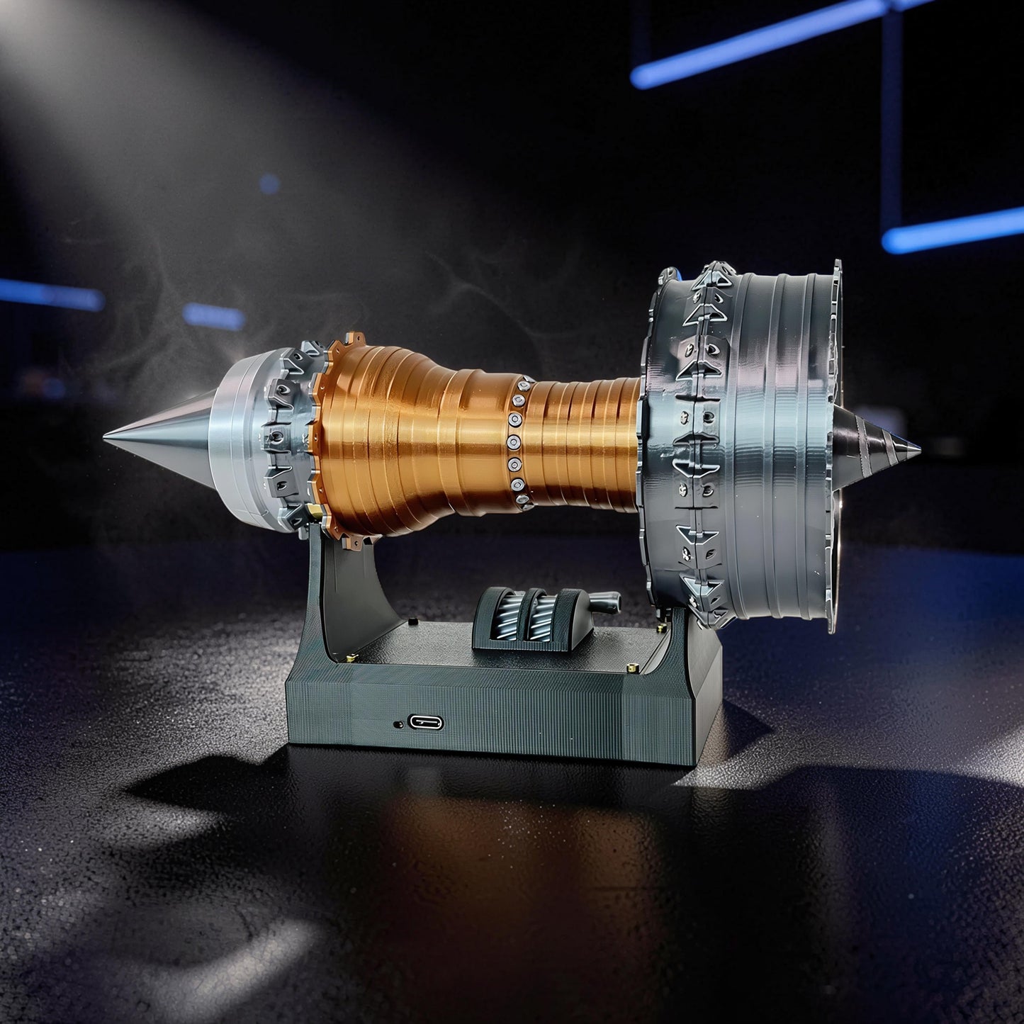 The Curious Mind TR900 Turbofan Engine model, 24cm, gold and silver PLA, on a black stand with throttle controls.