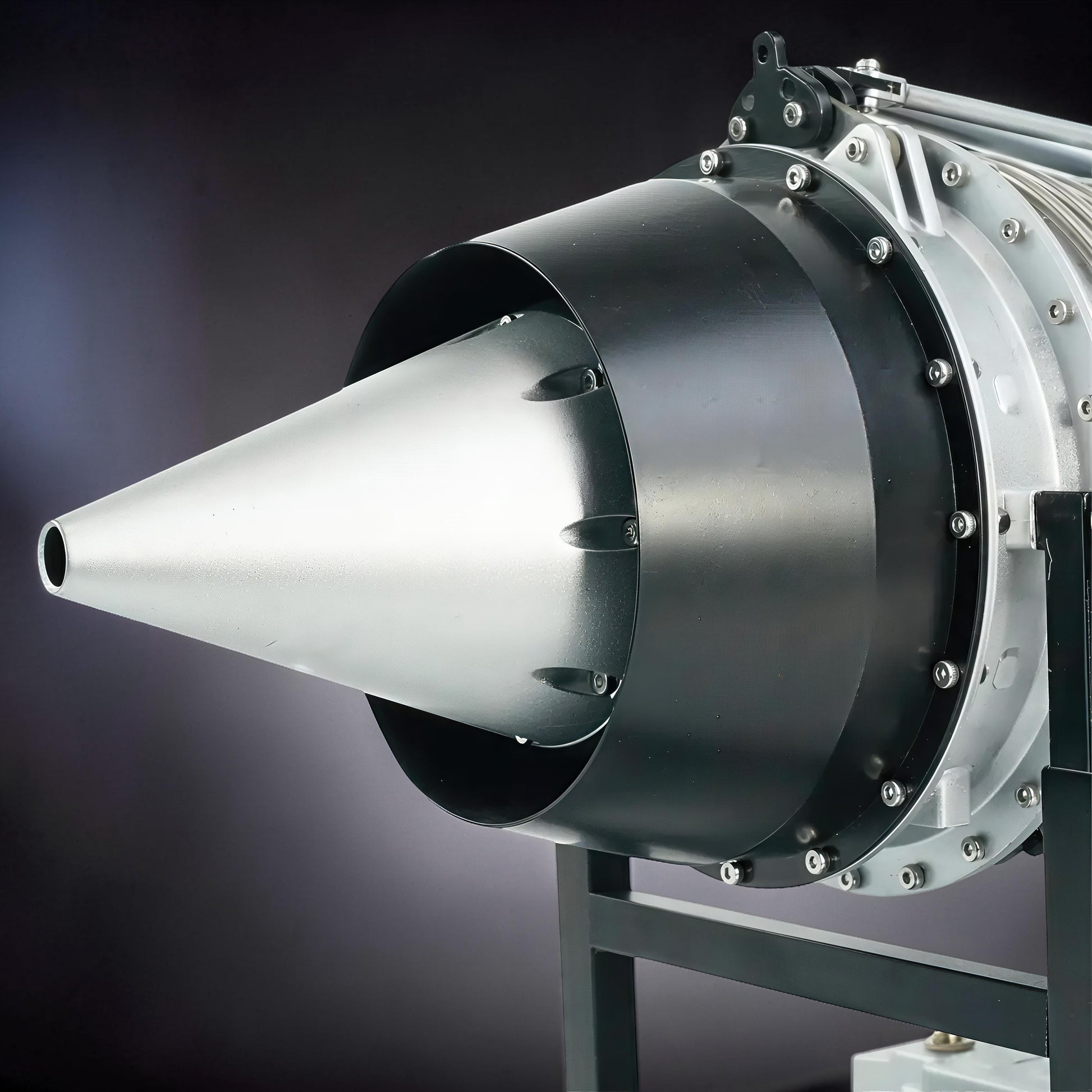 The Curious Mind Large Turbofan Engine DIY Kit model, a detailed metal aviation build model with silver and black components on a stand.