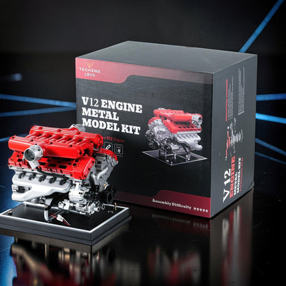 The Curious Mind V12 Car Engine DIY Kit, a detailed metal model with red and silver components on a black display base.
