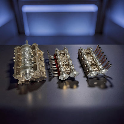 The Curious Mind V8 car engine DIY kit, a detailed metal mechanical model with intricate parts and a realistic design, perfect for display.