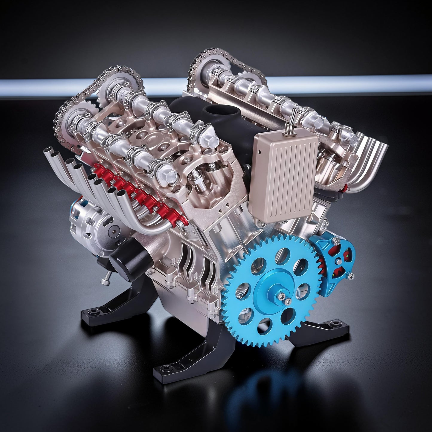 The Curious Mind V8 car engine DIY kit, a detailed metal mechanical model with blue gears and red accents, displayed on a black stand.