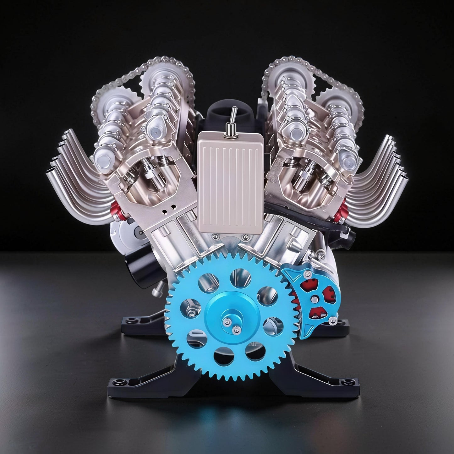 The Curious Mind V8 car engine DIY kit, a detailed metal mechanical model with a blue gear and silver components.