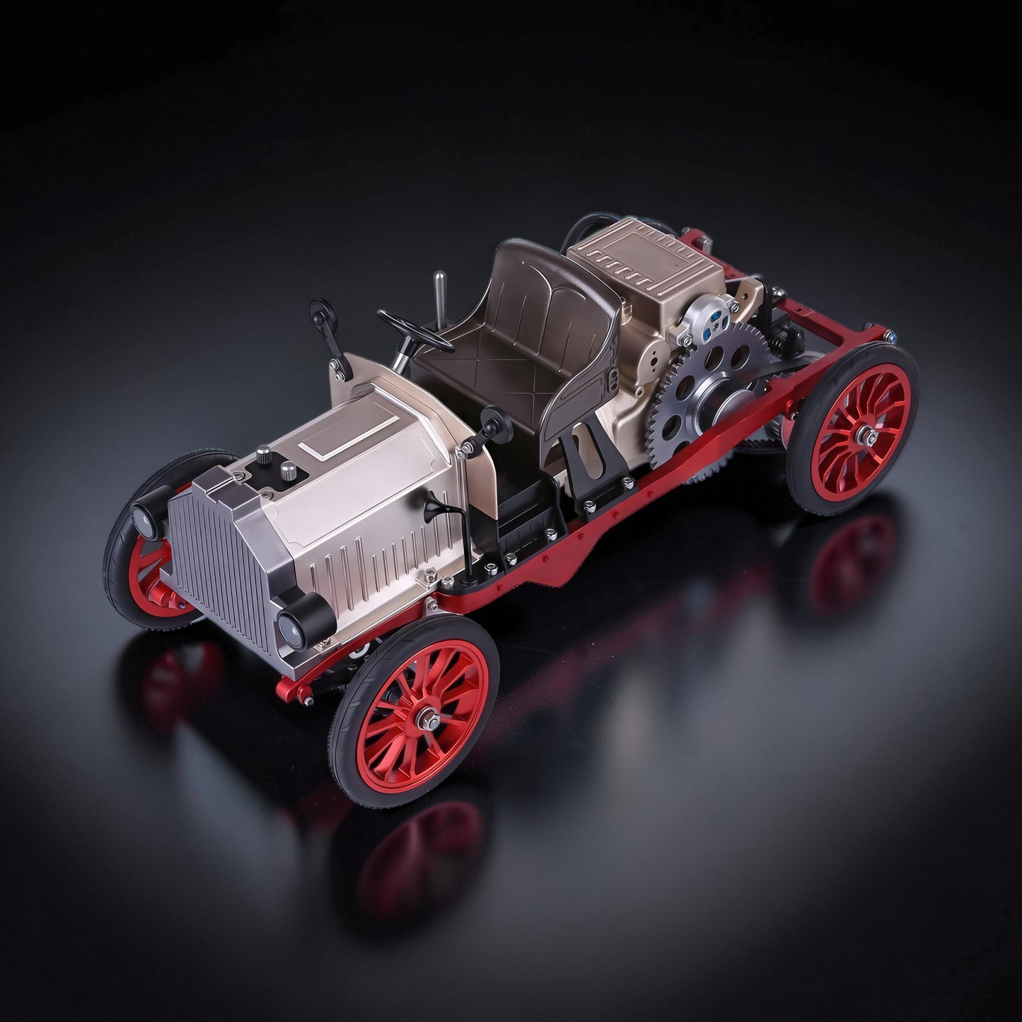 The Curious Mind Vintage Classic Car DIY Kit, a metal mechanical model with silver, red, and black accents. Features exposed gears and a detailed engine.