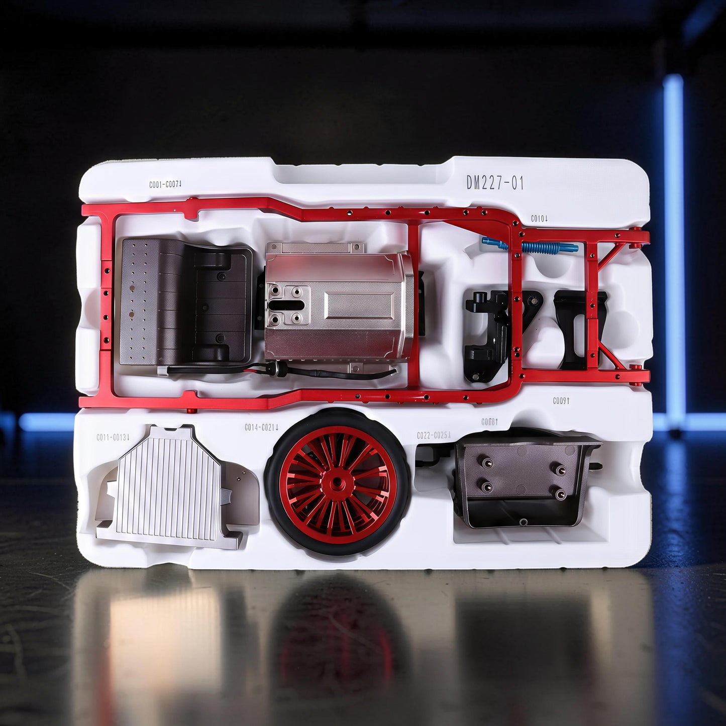 The Curious Mind vintage classic car DIY kit with metal engine, red wheel, and chassis parts in white packaging.