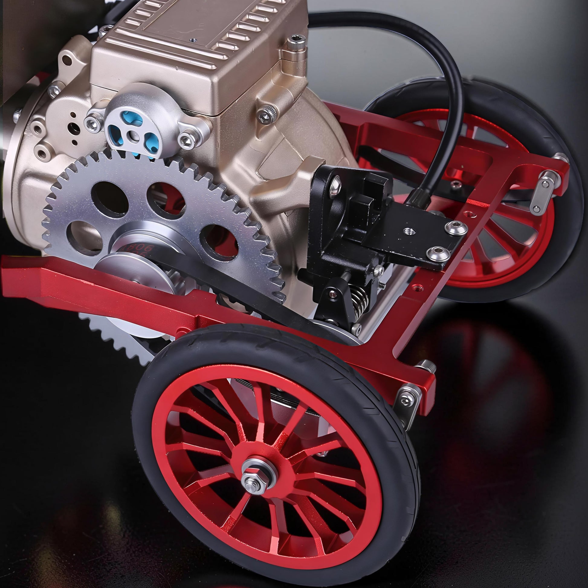 The Curious Mind Vintage Classic Car DIY Kit, a metal mechanical model with red frame, gold engine, and silver gears.